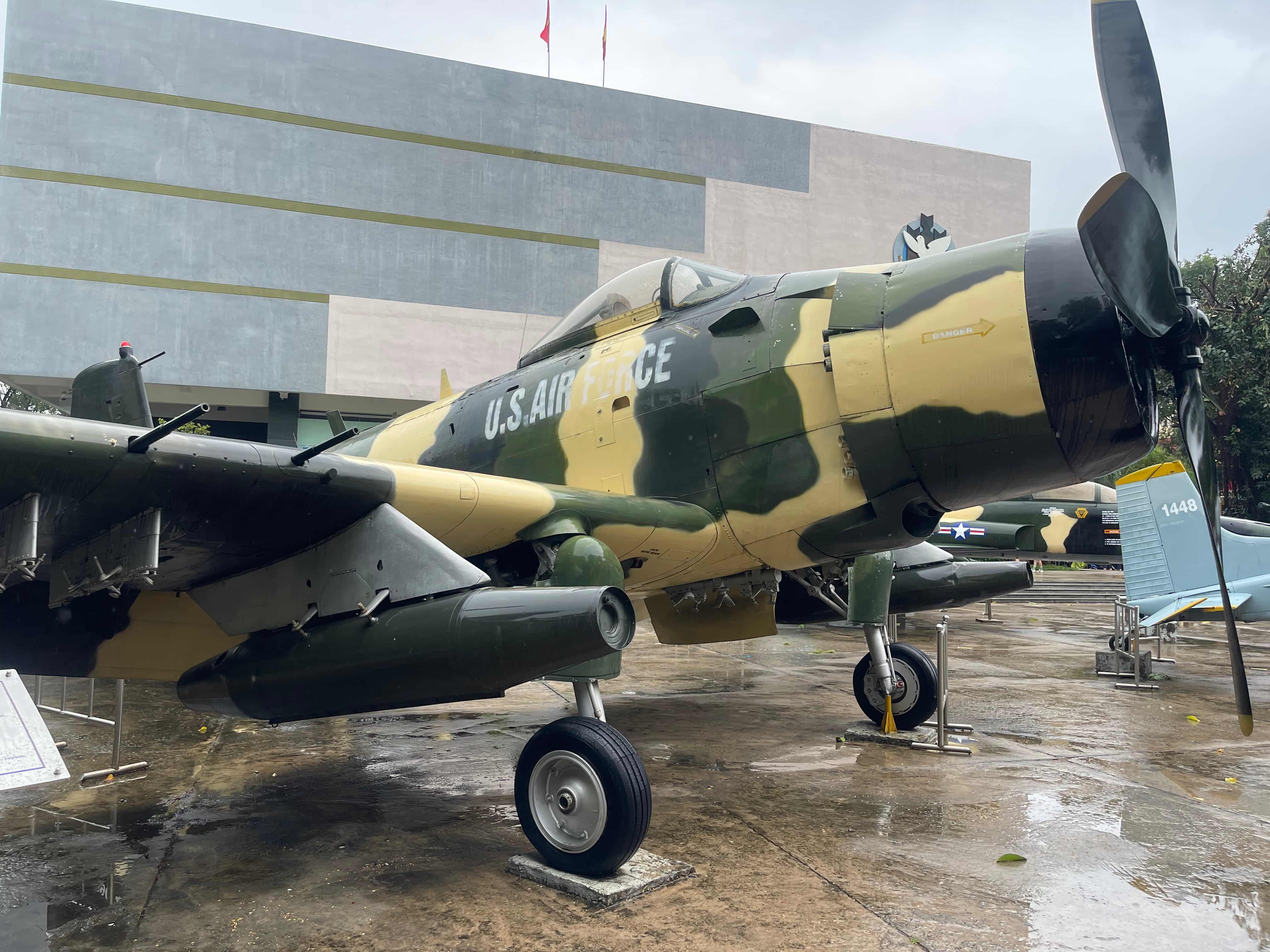 A US airforce fighter plane in front of a modernist building